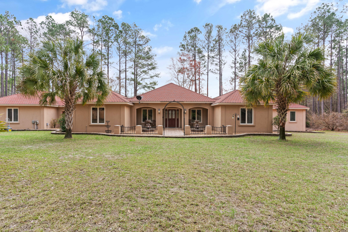 Luxury lakefront estate for sale in Hoboken GA with gated entrance and private 10-acre stocked lake.