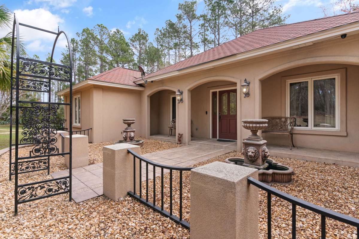 Luxury lakefront estate for sale in Hoboken GA with gated entrance and private 10-acre stocked lake.