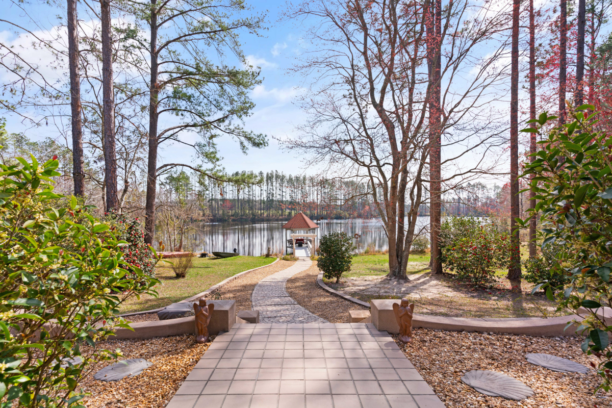 25-acre homestead with lake views, mature trees, and a private dock in Brantley County GA