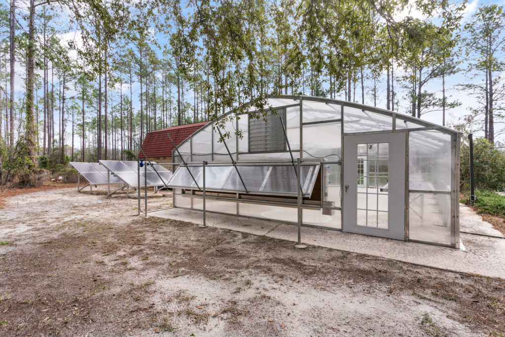 Solar-powered Atlas commercial greenhouse with an off-grid 12,000-watt lithium battery system