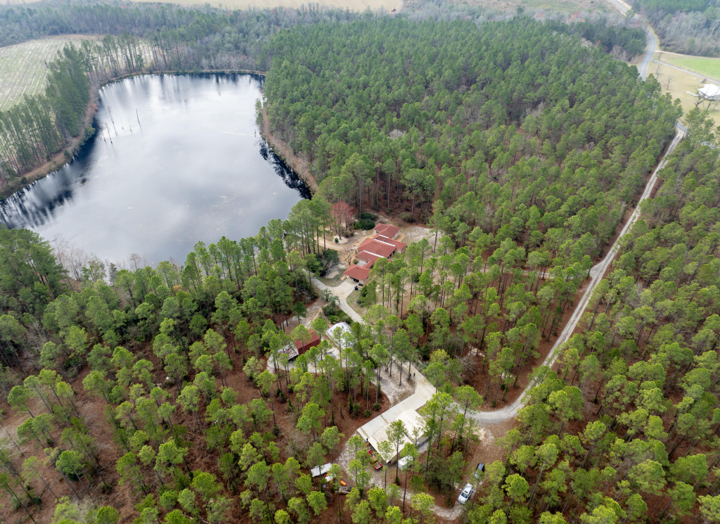 Aerial view of a luxury estate in Hoboken GA with a private lake and sustainable features