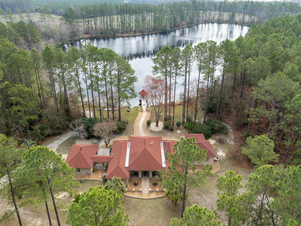 Aerial view of a luxury estate in Hoboken GA with a private lake and sustainable features