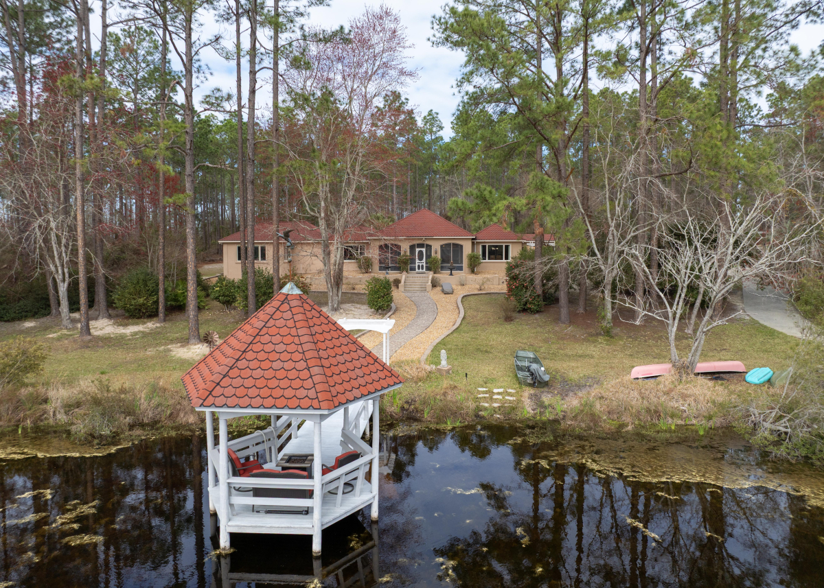 Aerial view of a luxury estate in Hoboken GA with a private lake and sustainable features