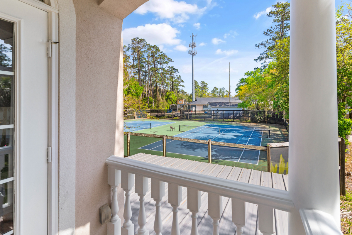 Community pool and tennis courts in gated Hampton Plantation neighborhood