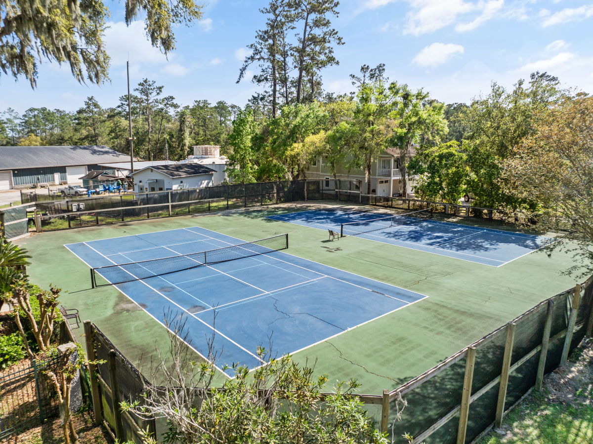 Community pool and tennis courts in gated Hampton Plantation neighborhood