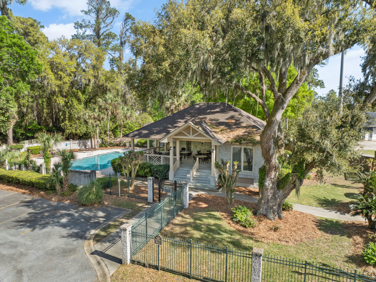 Community pool and tennis courts in gated Hampton Plantation neighborhood