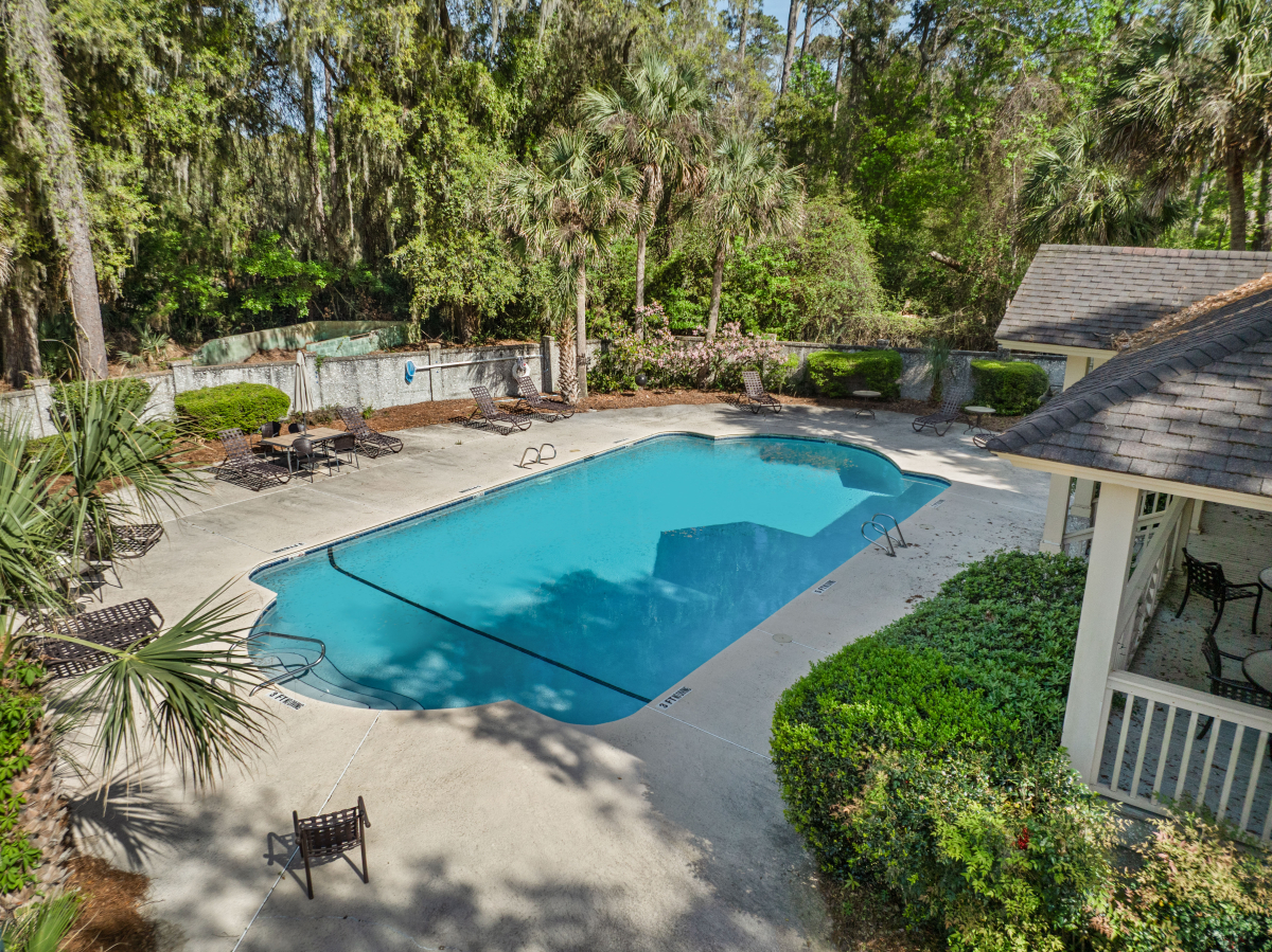 Community pool and tennis courts in gated Hampton Plantation neighborhood