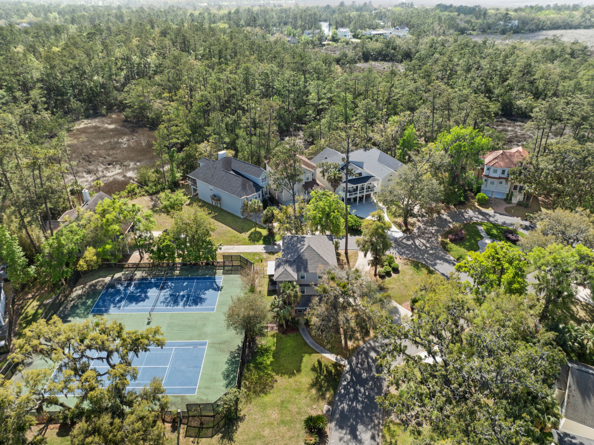 Community pool and tennis courts in gated Hampton Plantation neighborhood
