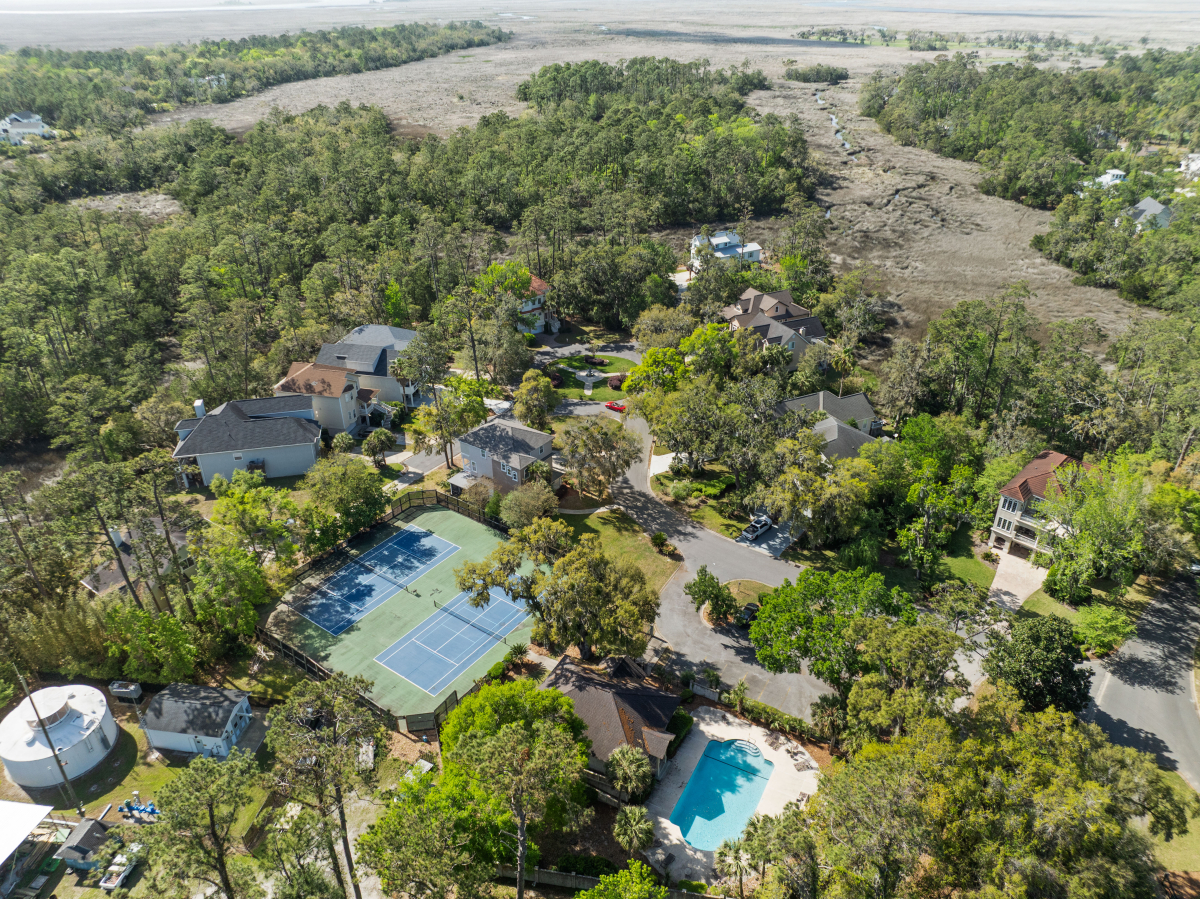 Community pool and tennis courts in gated Hampton Plantation neighborhood