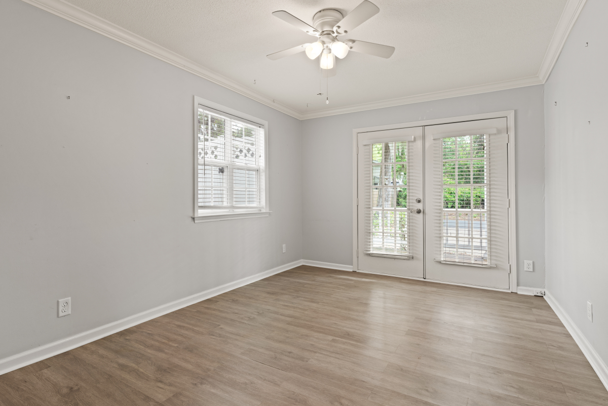 DSC03310 Spacious guest bedroom with French doors to the exterior in St Simons Island home for sale