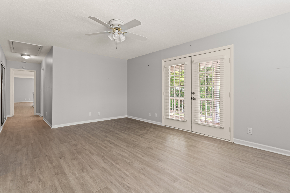 DSC03375 Spacious guest bedroom with French doors to the exterior in St Simons Island home for sale