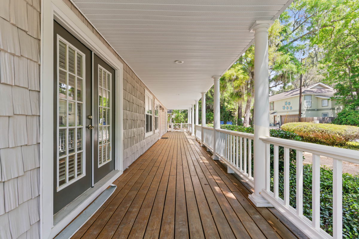 DSC03407 Expansive 62-foot covered porch with white railings on St Simons Island home