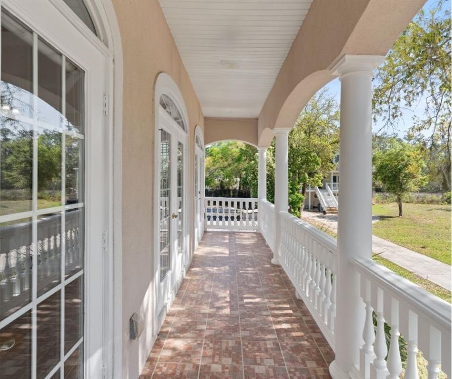 Private balcony overlooking oak trees at home in Hampton Plantation St Simons Island